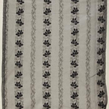 Machine embroidered net.